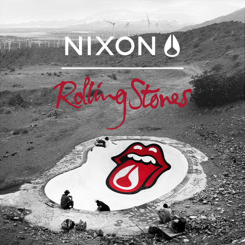 Nixon and Rolling Stones collaboration image featuring a skate bowl with the iconic red tongue logo, set in a black and white desert landscape with wind turbines.