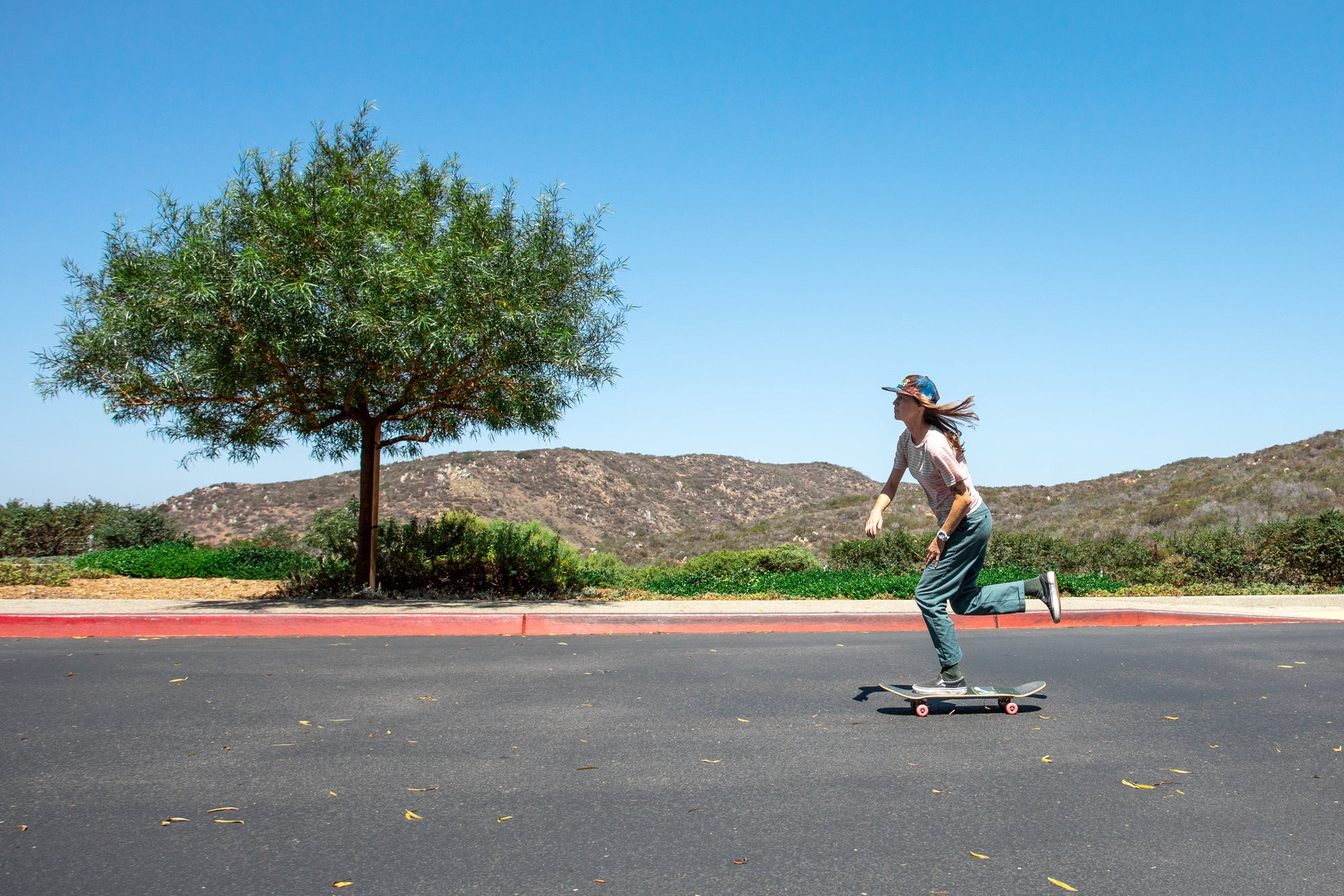 Artist Hannah Eddy skateboarding at the Nixon watches headquarters